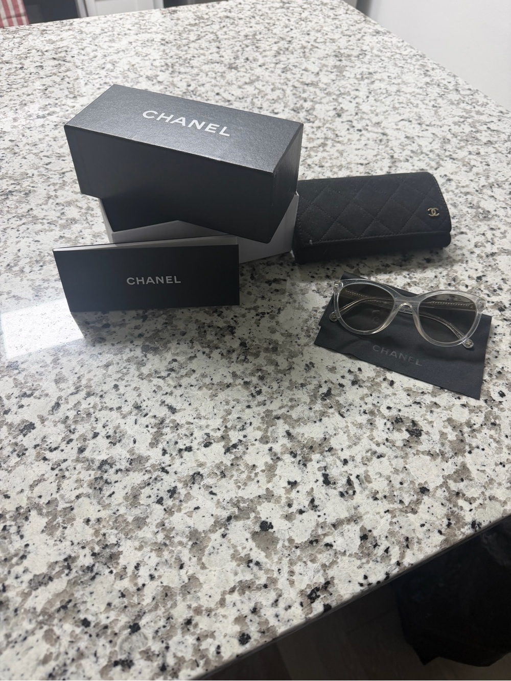 CHANEL Clear Frame Sunglasses with Black Quilted Case